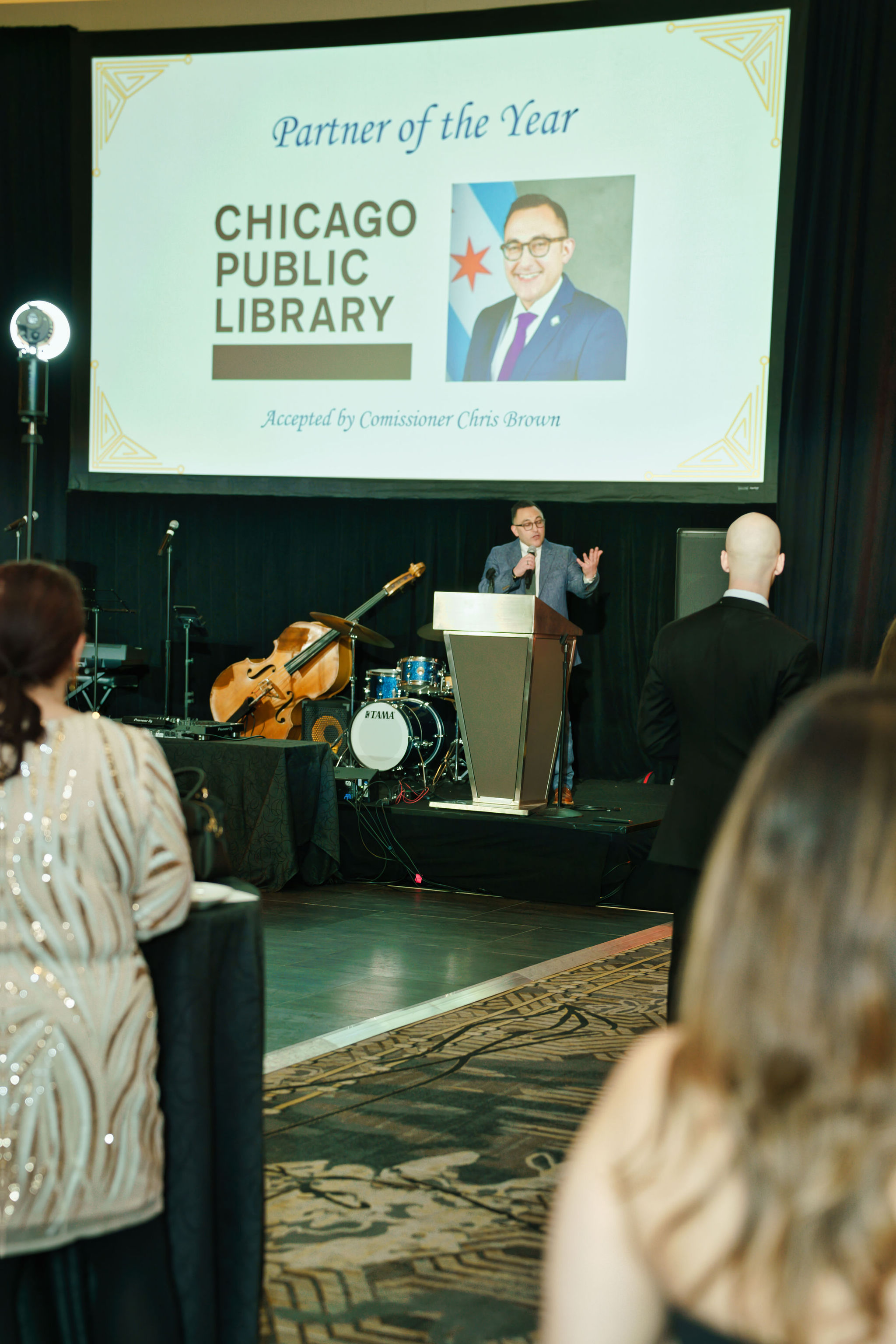 Chicago Public Library Commissioner Chris Brown accepts the JLC Partner of the Year Award