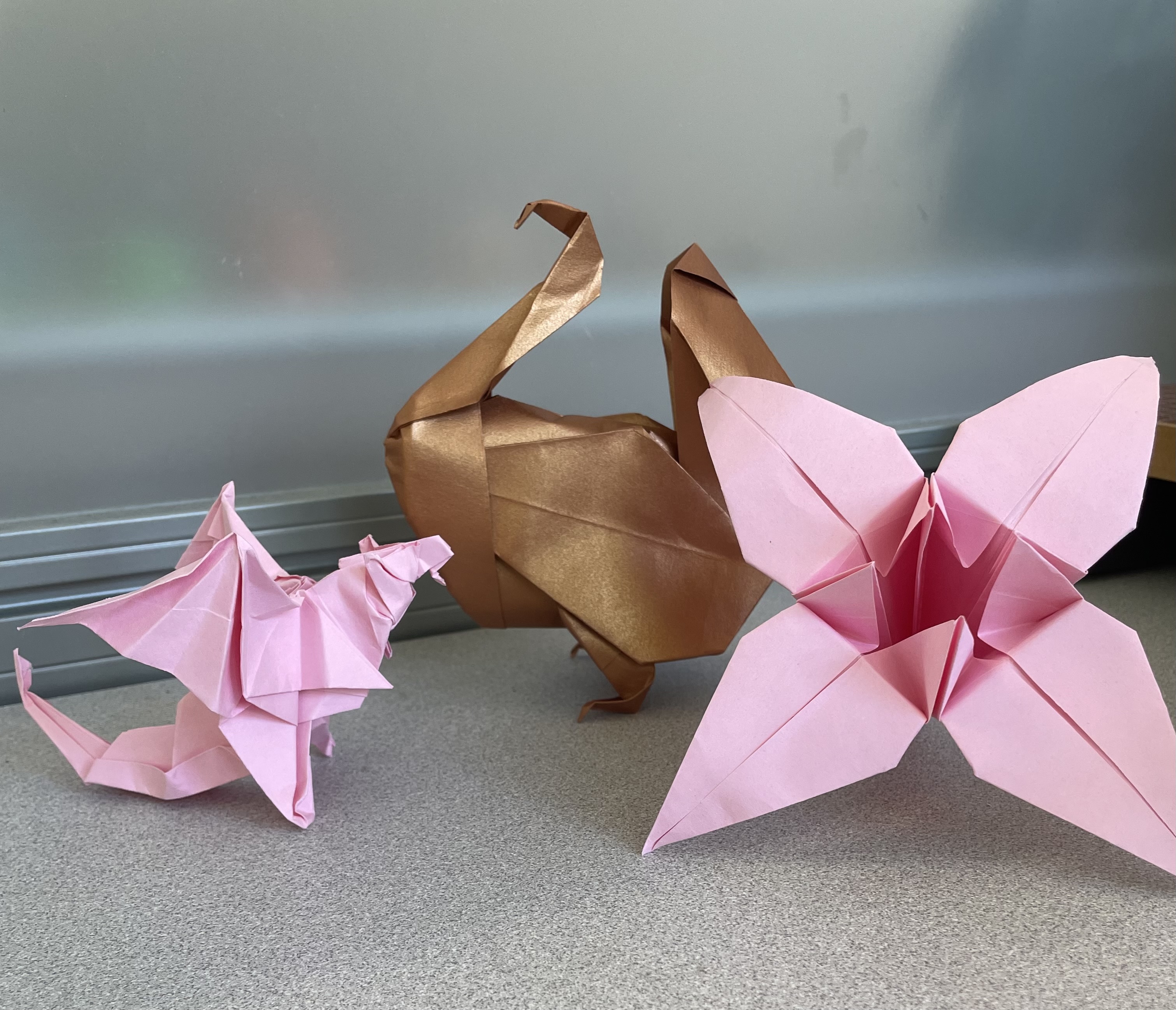 Cranes, dragon, turkey, and lily origami pieces