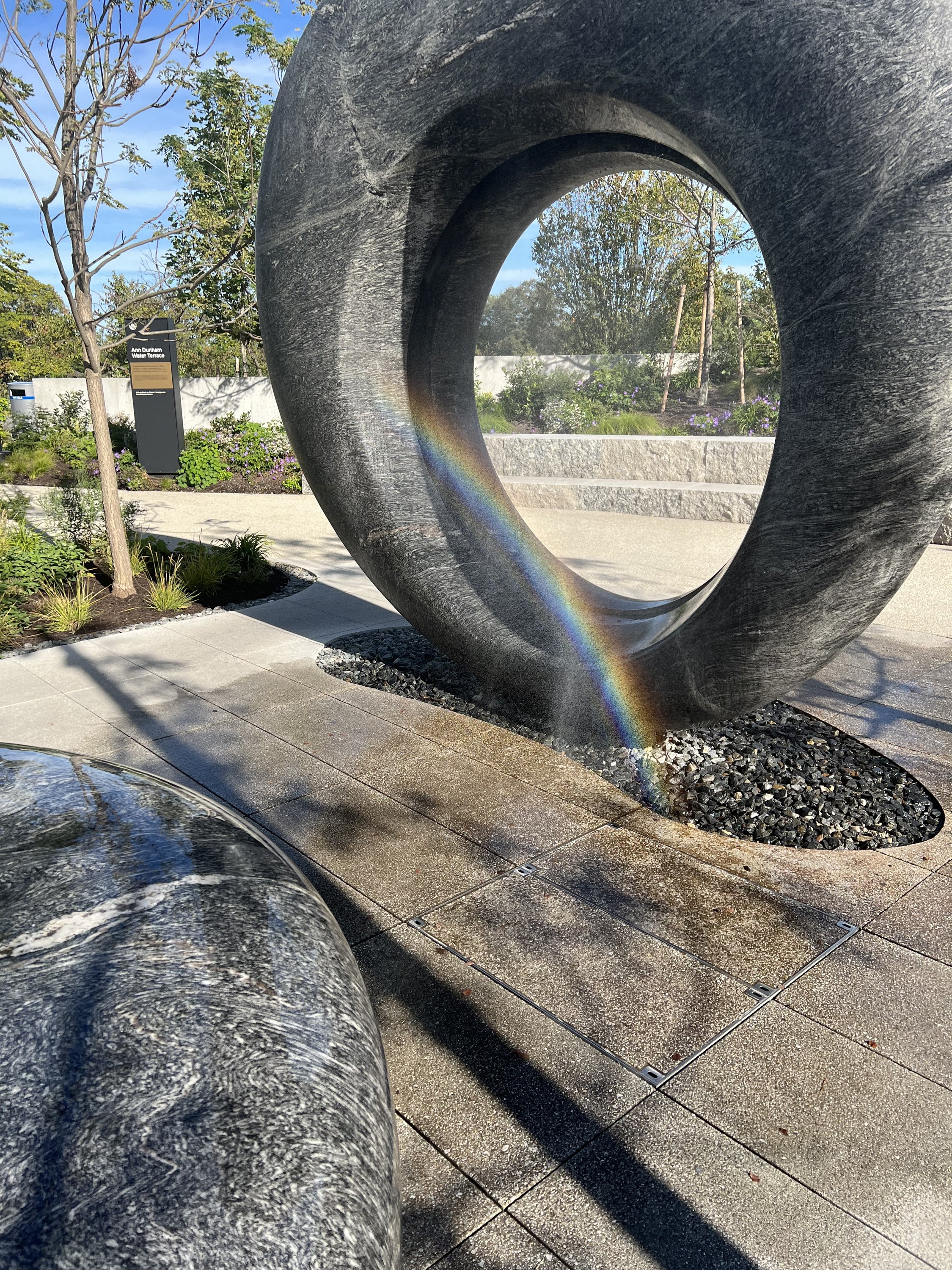 Detail with Rainbow “Seeing Through the Universe,” Maya Lin’s sculptural water installation, two rounded granite forms, Outdoor Grounds/ Ann Dunham Water Terrace/ Obama Presidential Center. September 2026. Photo: S. Zetouni